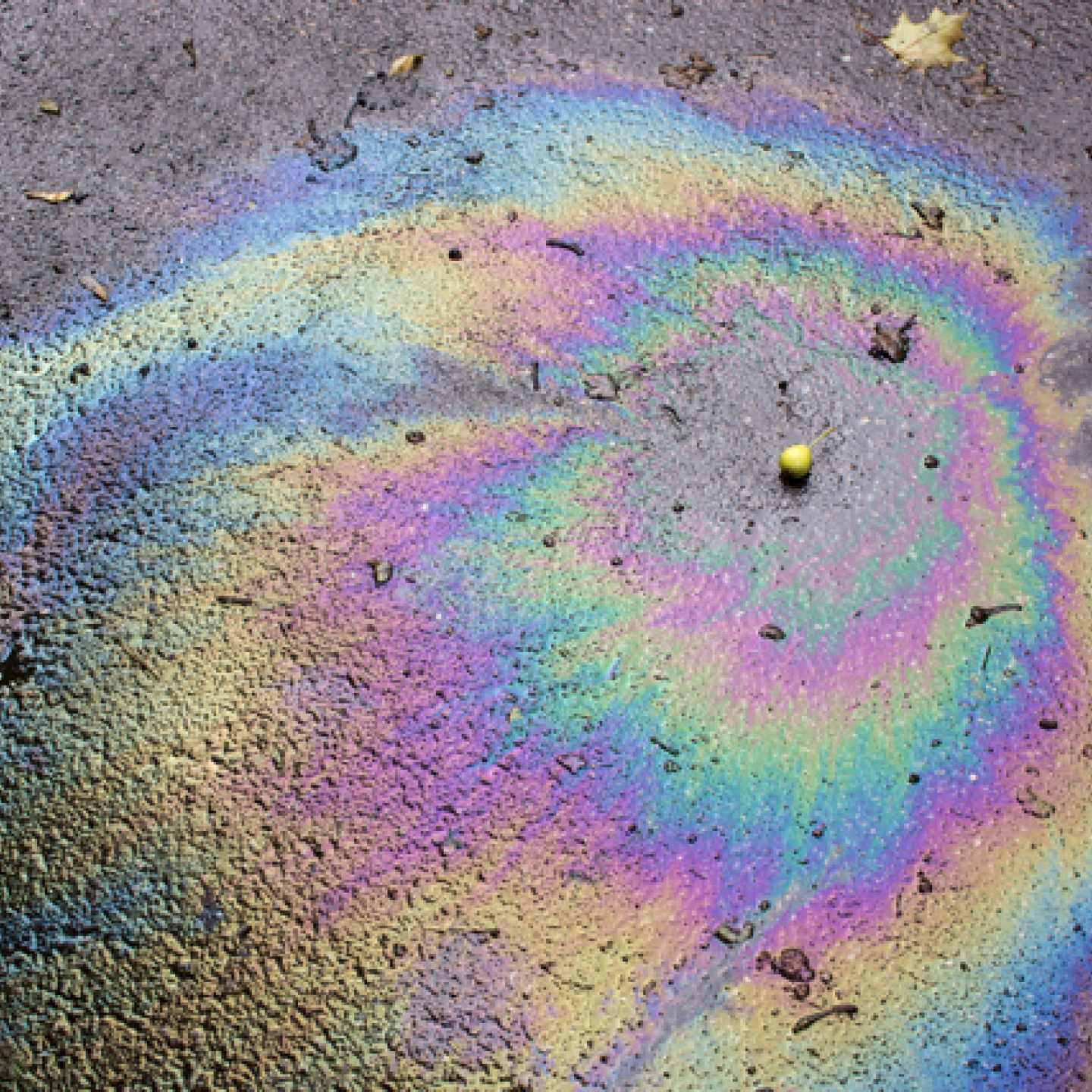 iridescent spot of gasoline petrol on the asphalt 2022 11 15 10 49 54 utc normaal