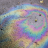 iridescent spot of gasoline petrol on the asphalt 2022 11 15 10 49 54 utc normaal