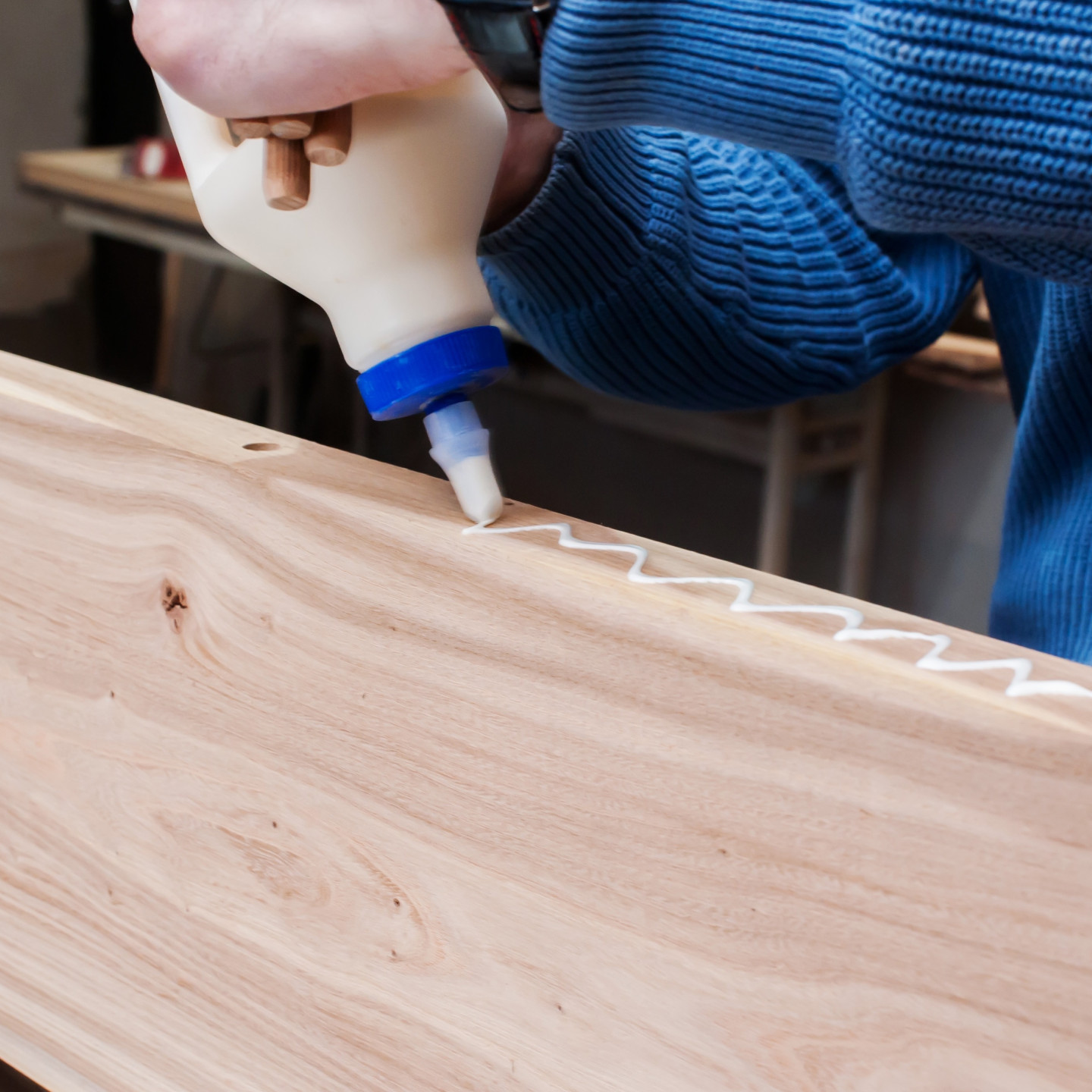 man applying glue to wood and gluing boards in car 2022 11 09 08 46 45 utc